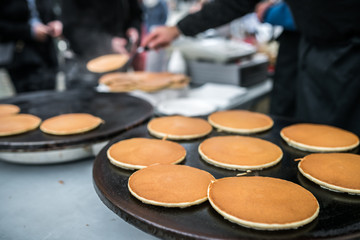 Delicious pancakes on sale on the street food market