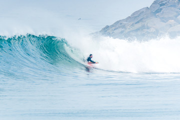 Bodyboarder surfing ocean wave