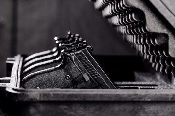 black handgun in plastic Secure Storage Case