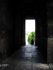 Boy at end of dark hall