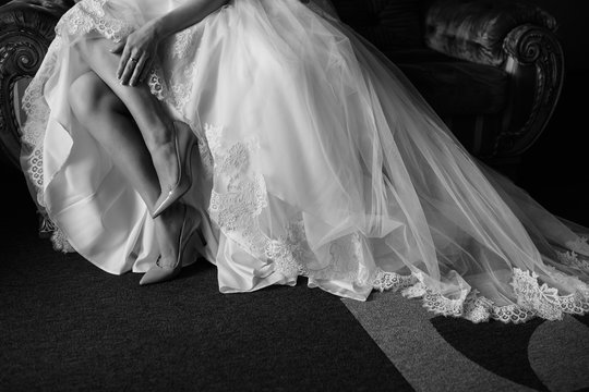 Black and white wedding photo. Beautiful bride in luxure wedding dress
