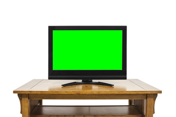 Flat Screen Television on Large Wood Table Isolated on White with Chroma Key Green Screen
