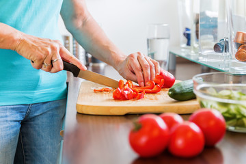 woman in the kitchen preparing salad