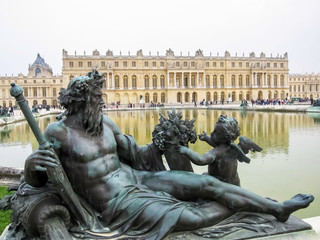 Bronze Statue in Foreground at Versailles