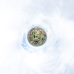 Aerial city view with crossroads and roads, houses, buildings, parks and parking lots, bridges. Helicopter drone shot. Wide Panoramic image.