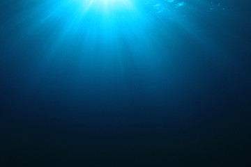 Obraz premium Abstract underwater blue background and sunlight