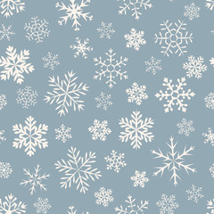Seamless simple pattern of different blue geometric snowflakes