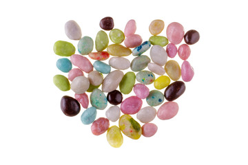 Multicolored candies over white background