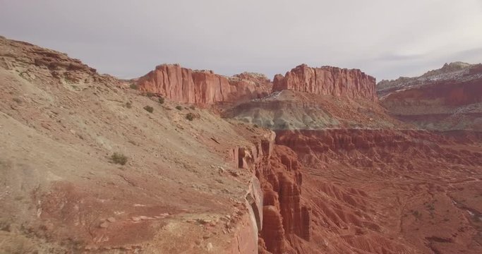 Aerial following of ridge-line in southern Utah National Park desert