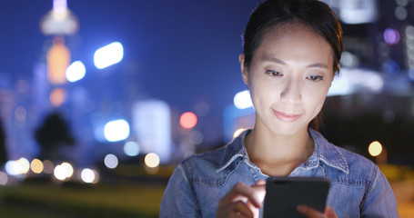 Woman use of cellphone in city of Hong Kong