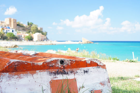 Stunning emerald water tyrrhenian sea with old boat in the foreground. Castel di Tusa, Sicily.