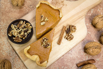 Pumpkin Pie Slices on Cutting Board