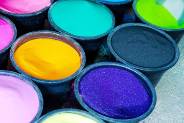 Colorful sands in boxes