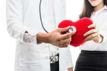 Close up Hand,Doctor cardiologist with red heart in the hospital