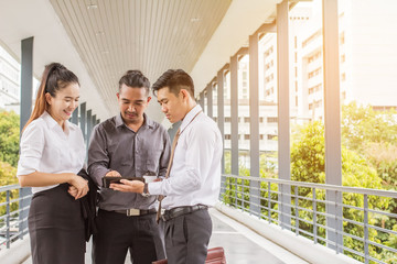 businessman and woman using tablet of working. Meetings promoting. Together create a mutually beneficial,They had made an agreement that they would share the profits equally.outside