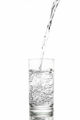 Water poured in a glass transparent white background