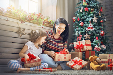 Mother and daughter exchanging gifts