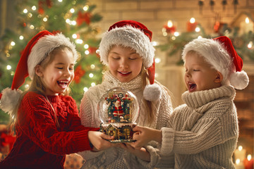 children with snow globe