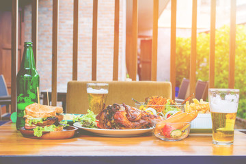 .Beer, turkey, vegetable salad, sandwiches and chips on wooden boards, concepts Holiday food