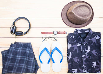 Casual apparel and accessories on a background of wood.Top view