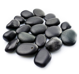 Fototapeta na wymiar Massage stones on white. Black Stones isolated