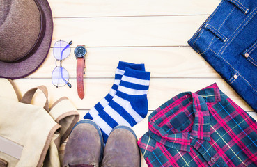 Casual apparel and accessories on a background of wood.Top view