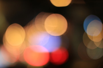 Bokeh Abstract background from car in street in night time. Elegant abstract background with bokeh defocused lights.