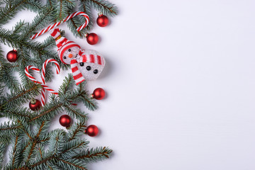 Naklejka na ściany i meble Christmas background with fir tree and snowman