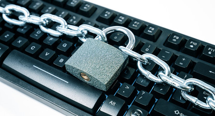 Computer cybersecurity concept with chain and padlock