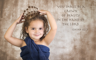 Little girl wearing crown with Bible verse on grunge background