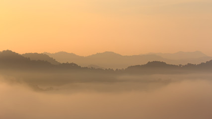 Fototapeta na wymiar Sunrise and sea of mist at Khao Phanoen Thung, Kaeng Krachan National Park in Thailand