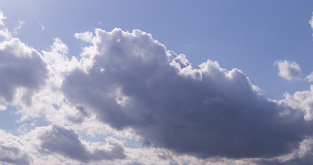 bright blue sky with clouds and sun. cumulus, background, weather.