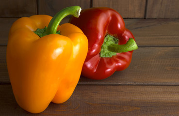 Juicy beautiful Bulgarian pepper on a wooden background