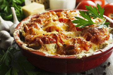 Fish baked with tomatoes, sour cream and cheese