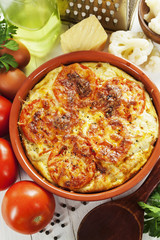 Cauliflower baked with tomato, cheese and eggs