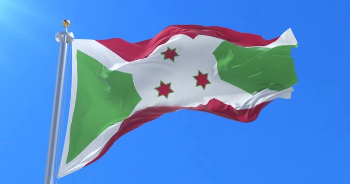 Burundi flag waving at wind in slow with blue sky, loop