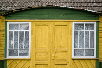 old yellow wooden house with window