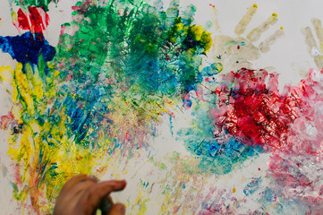 children painting with finger paint