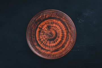 Clay dishes. Plate. Top view. Free space for your text.