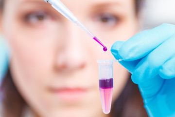 Female technician doing science experiment