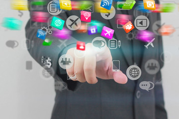 Businessman touch social media icons.