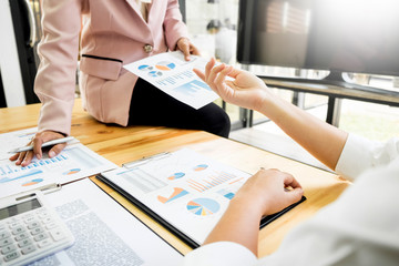 Team work process. young business managers crew working with new startup project. laptop on wood table, typing keyboard, texting message, analyze graph plans.