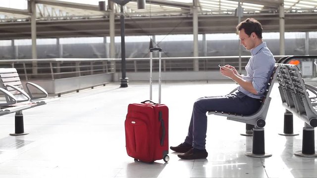 passenger in airport doing check in on mobile phone