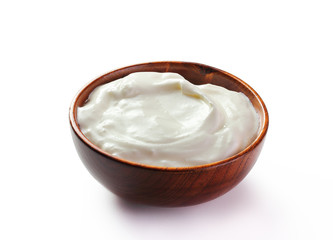 cream sour in a plate isolated white backround