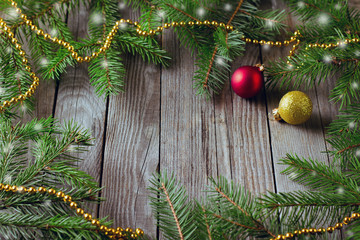 Rustic christmas background with fir tree on wooden background.Top view with space for text.