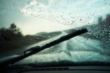 Windscreen wiper, rain on highway - obrazy, fototapety, plakaty