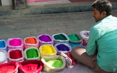 Street seller in Kathmandu selling Rangoli powder for Diwali