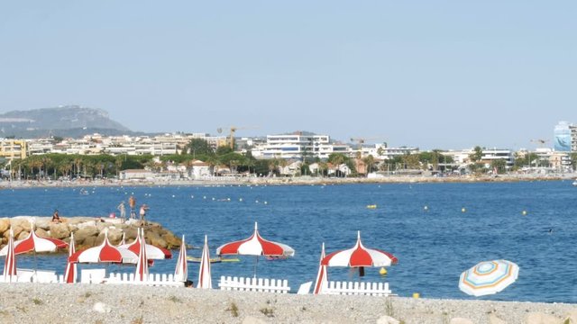 Tourists sun bathing on a summer beatch - 4k