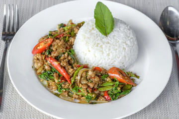 Stir-fried with minced pork and basil on white plate (Pad Ka Prao Moo)