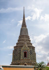 Fototapeta premium Pagoda is in Wat Pho that was named as the temple of the pagoda or chedi that are decorated with yellow glaze or glazed tiles or dark blue